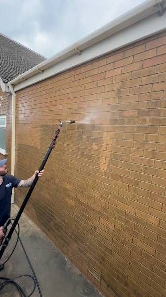 Soft washing a brick home exterior
